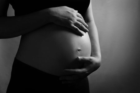 Pregnant woman with black white color